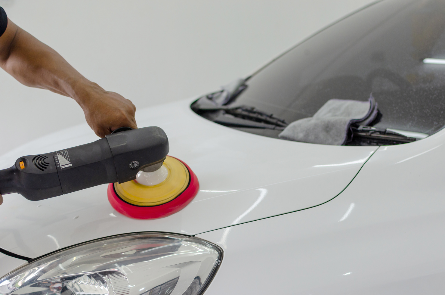 Auto Detailing Car with Polisher